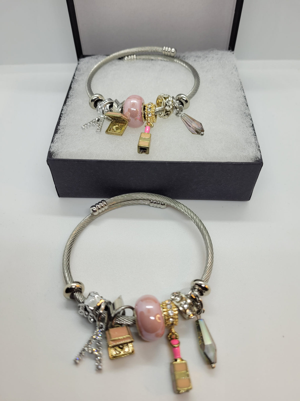 Pink lipstick and A charm bracelet